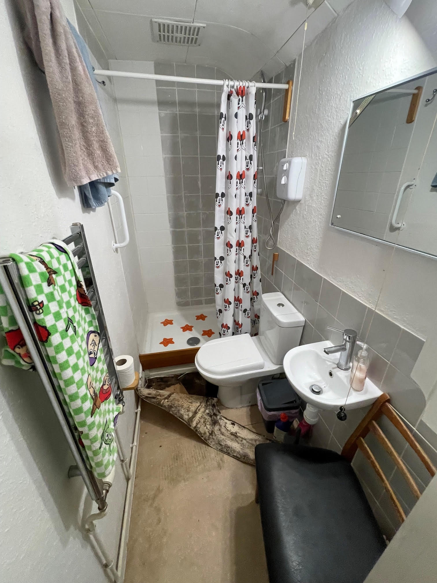 Before photo of bathroom floor damage before renovation in Kent